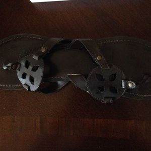 Brown flip flops with gold studs