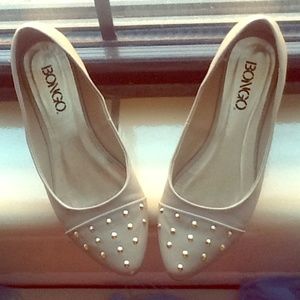 Nude flats with gold studs.
