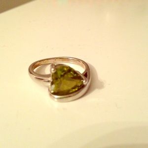 Silver ring with green heart shaped gemstone