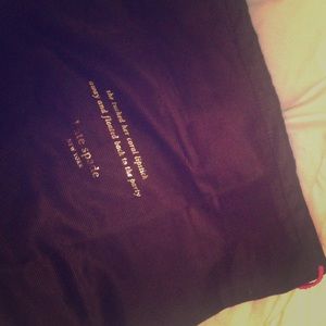 Kate Spade dust bags: one large, one small.