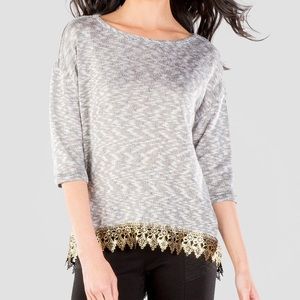 Gray tee with metallic gold trim.