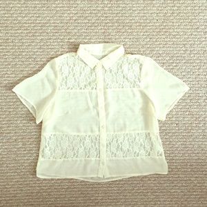 A flower laced button up short sleeve blouse.