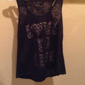 See through tank top says love to live.
