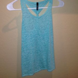 Mint green tank top. Back crossed in. Large