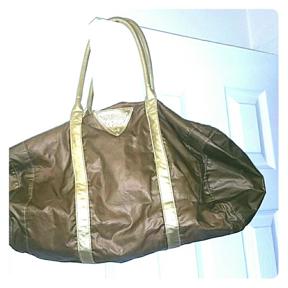 Gold Guess bag medium overnight bag