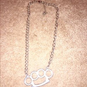 Cute silver brass knuckles necklace!