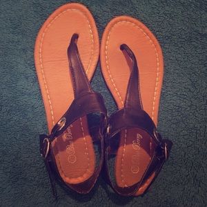 Brown sandals with black straps