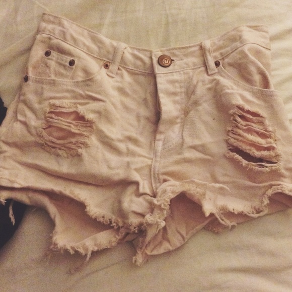 Distressed pastel pink shorts