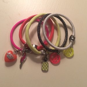 A set of 5 juicy couture hair ties with charms