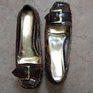 BCBGirls brown leather flats. Gold buckle.