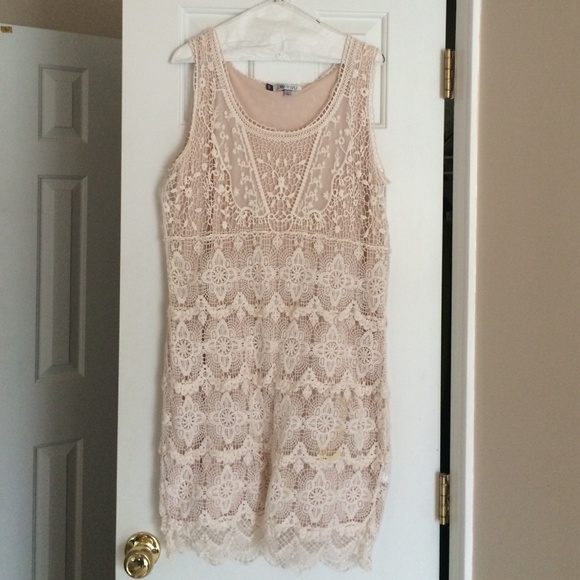 Jennifer Lopez eyelet cream dress