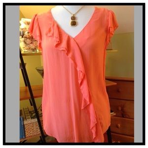 Orange sheer ruffled top from Anthropologie