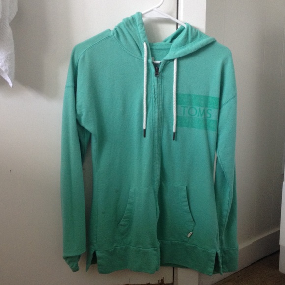 Toms mint/green jacket with a hood and pockets.