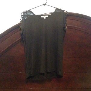 Black top with gold chain accents on shoulders