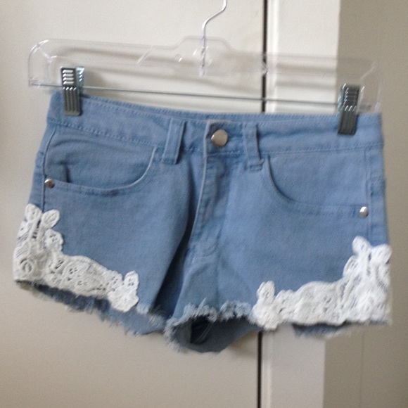 Blue short shorts with white lace detail