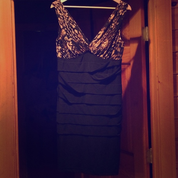 Dresses & Skirts - Cute and sexy black and lepord print dress.