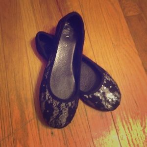 Silver and black flats