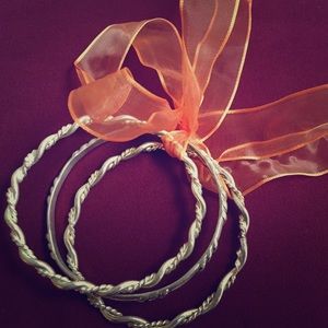 Three Silver Bracelets