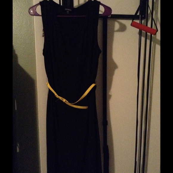 Black cocktail dress with yellow belt