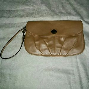 Beige Coach wallet organizer wristlet