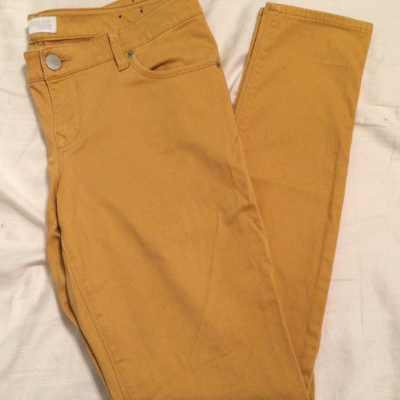 Express mustard skinny jeans