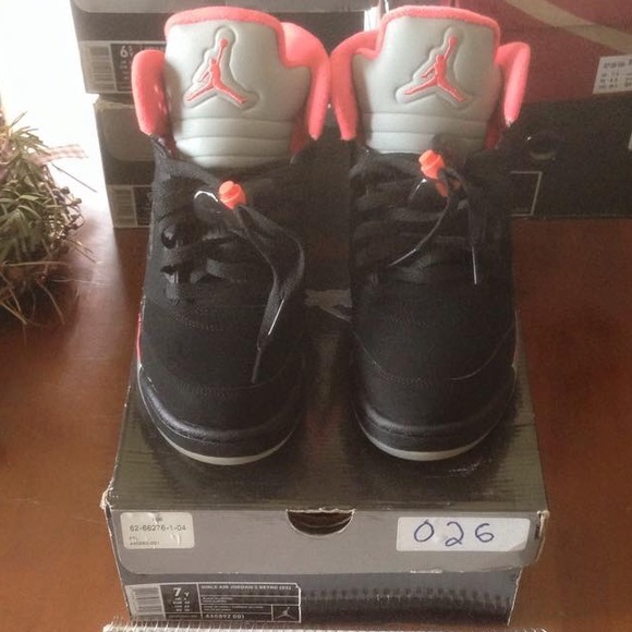 Black/alarming red Jordan 5s