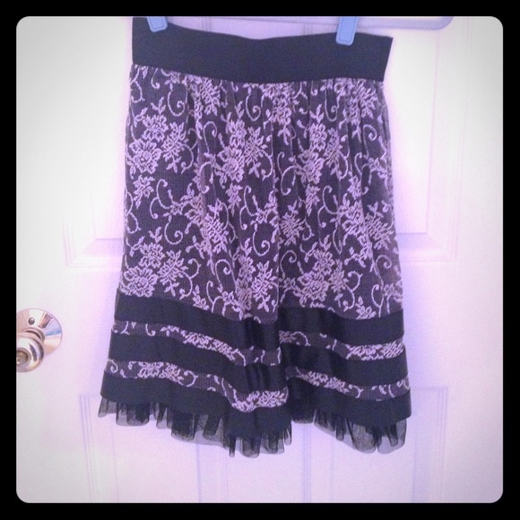 Black lace skirt with ribbon detailing.