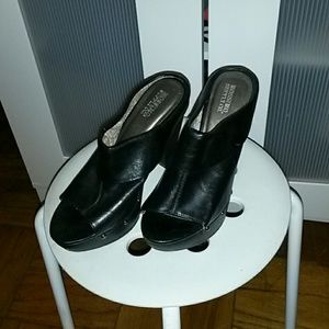 Black slip on clog small white spot on top of heal