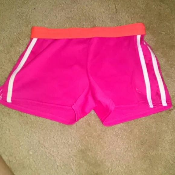 Pink shorts with orange band and white stripes