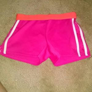 Pink shorts with orange band and white stripes