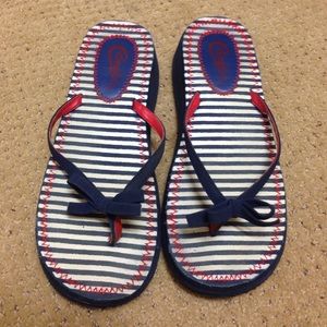 Candie's red white and striped flip flops.