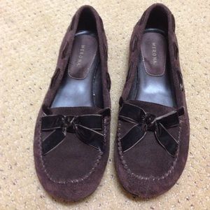 Chocolate brown suede slip ons with velvet bow.