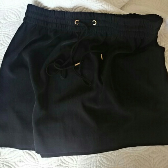 Express black mini skirt wet it gold tip ties