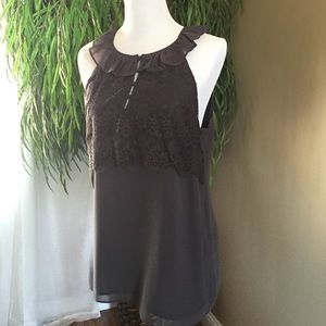 Delicate lace and ruffle sleeveless blouse