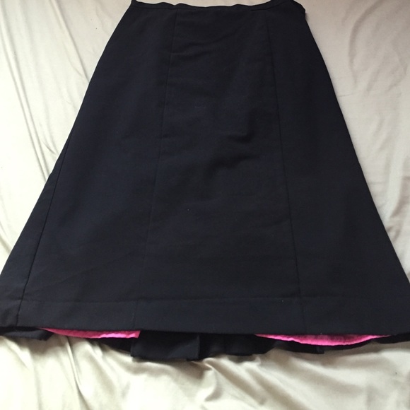 Classy black pencil skirt with hot pink lining.