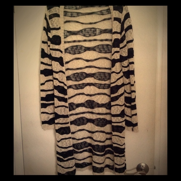 Beige and black knit sweater.