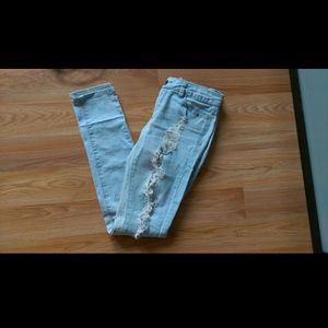 Light blue skinny ripped jeans