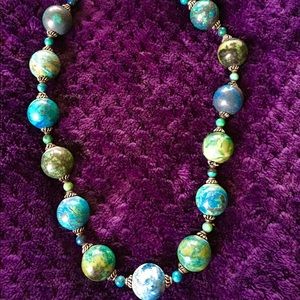A high end, beaded necklace w/ beautiful colors.