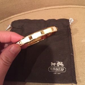 2 auth coach bangles. White& black with gold spike