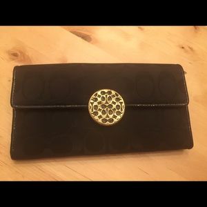Black and gold Coach wallet