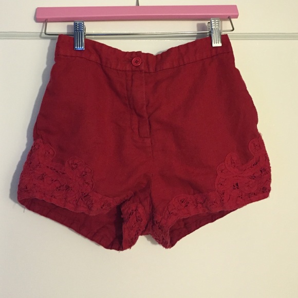 Red high waisted ecote shorts with lace detail