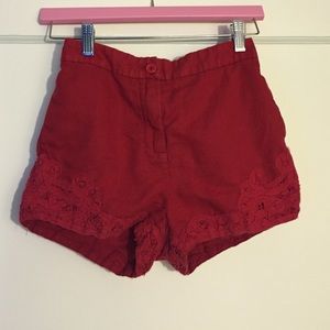 Red high waisted ecote shorts with lace detail