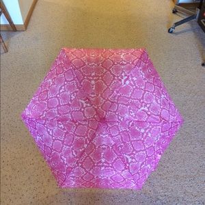 Pink snakeskin umbrella.