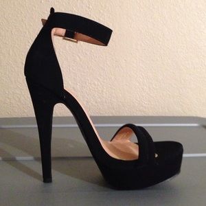 Ankle strap open toed faux suede sandals.