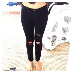 Ripped black skinny jeans