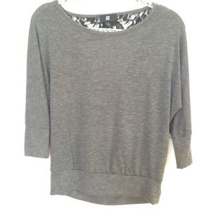 Grey shirt with a low back and lace