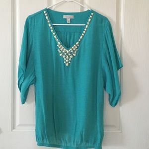 Turquoise top with bead work.
