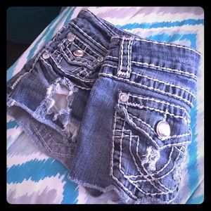 Distressed medium wash shorts