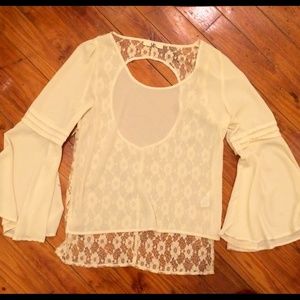 Sheer blouse with lace cut out back