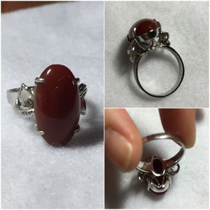 Silver ring with red/orange jewel size 8